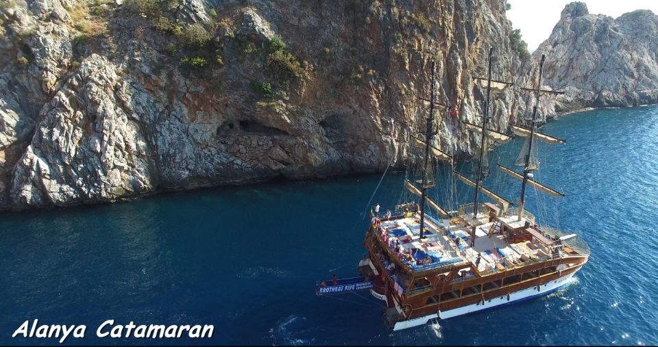 Alanya: Catamaran Boat Trip with Swim Stops and Sunbathing - The Departure: Red Tower, Old Shipyard, and Settling In Fast