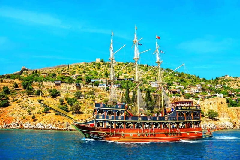 Alanya: Pirate Boat Tour with Food and Drinks - Cleopatra Beach: Photos, a Swim Moment, and a Dolphin-Watching Window