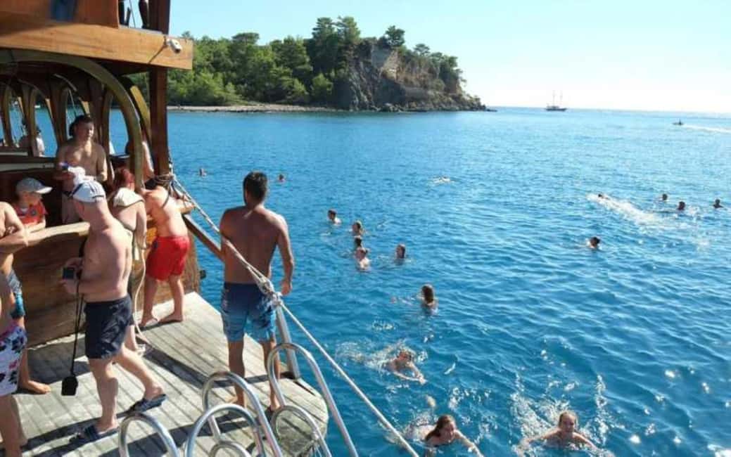 Antalya Boat Tour: Düden Waterfall, Swim & Soft Drinks - Turquoise swims and coastal caves near Lara Bay: what you do on the water