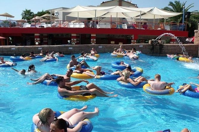 Atlantis Water Park Marmaris and Icmeler - Free Shuttle Services - The private beach setup: sunbeds, umbrellas, and real downtime