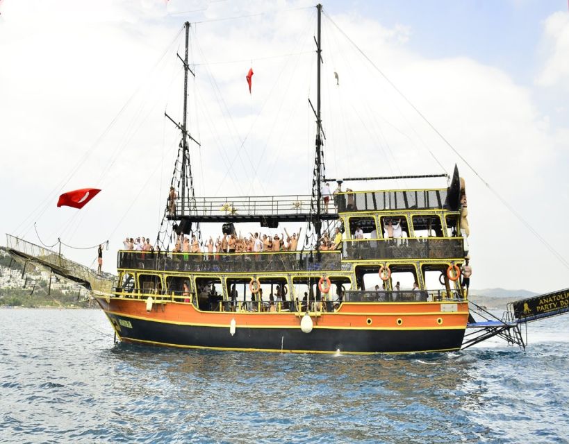 Bodrum: Pirate Boat Trip with BBQ Lunch and Optional Pickup - Boarding Anatolia Party Boat: the pirate-ship party setup