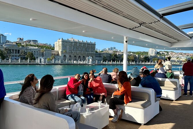 Bosphorus Daytime or Sunset Sightseeing Cruise & Audio Guide - Dolmabahçe Mosque: the elegant Ottoman signature you see first