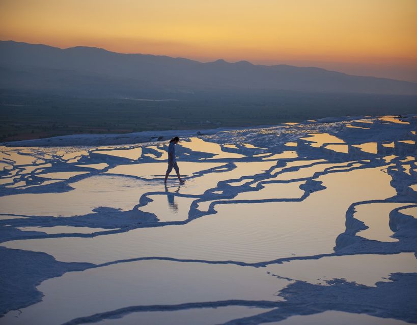From Marmaris: Pamukkale Evening Tour with Transfer & Dinner - Hierapolis ruins at dusk: amphitheater, necropolis, Roman baths