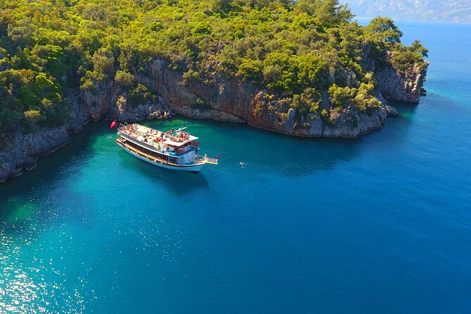 Full-Day Marmaris Boat Trip With Lunch & Unlimited Drinks - Amos Beach BBQ and Blue Flag swims: food, shade, and long enough breaks