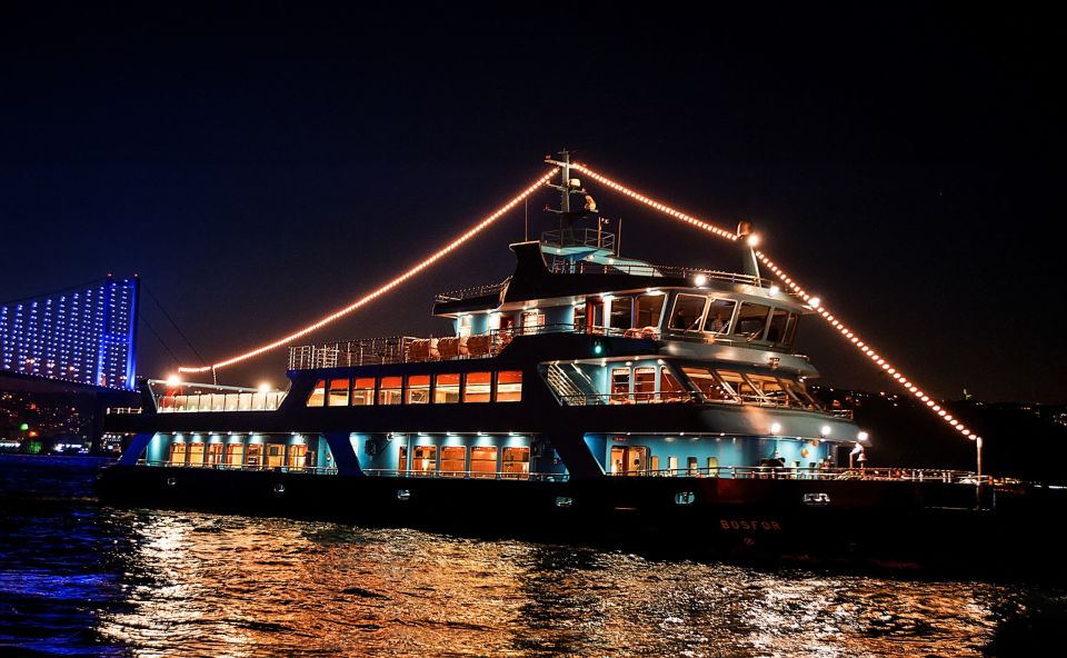 Istanbul: Bosphorus Dinner Cruise w/ Drinks & Entertainment - Rumeli fortifications, Bosphorus Bridge, and Fatih Sultan Mehmed Bridge glow