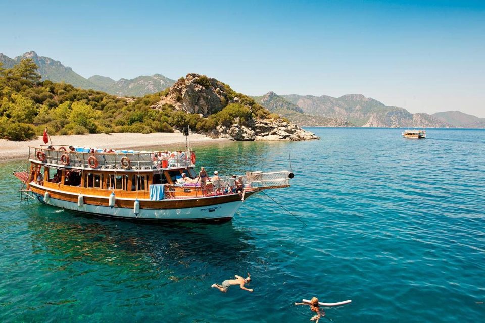 Marmaris: Boat Trip with Unlimited Drinks and BBQ Lunch - Entering the Day: Pickup in Marmaris and Boarding the Memories Boat