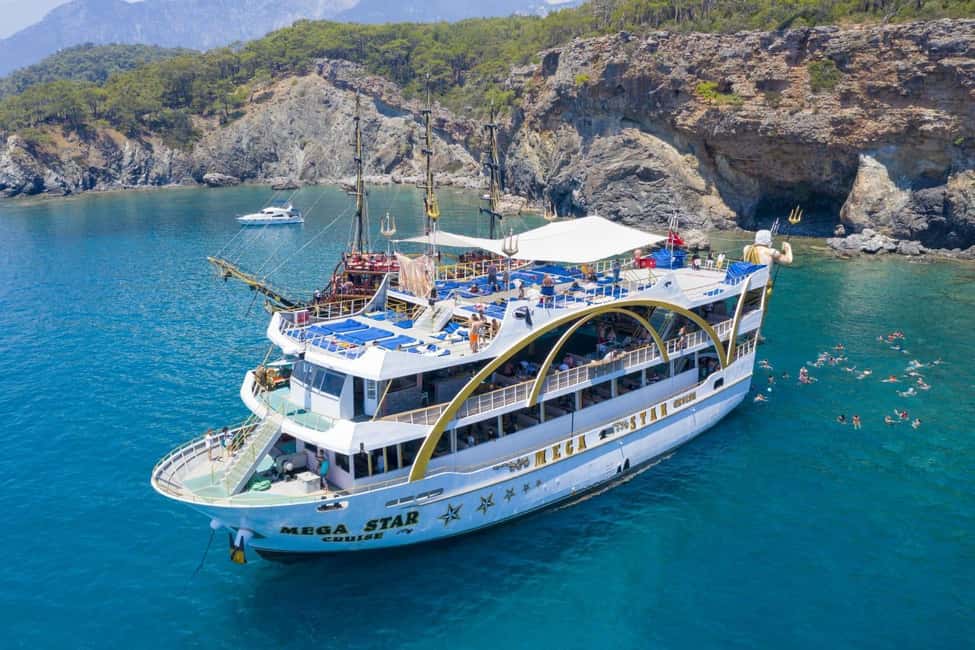 Megastar Boat Tour From Antalya Belek Kemer - Onboard setup: sun decks, shade, and a DJ-led atmosphere