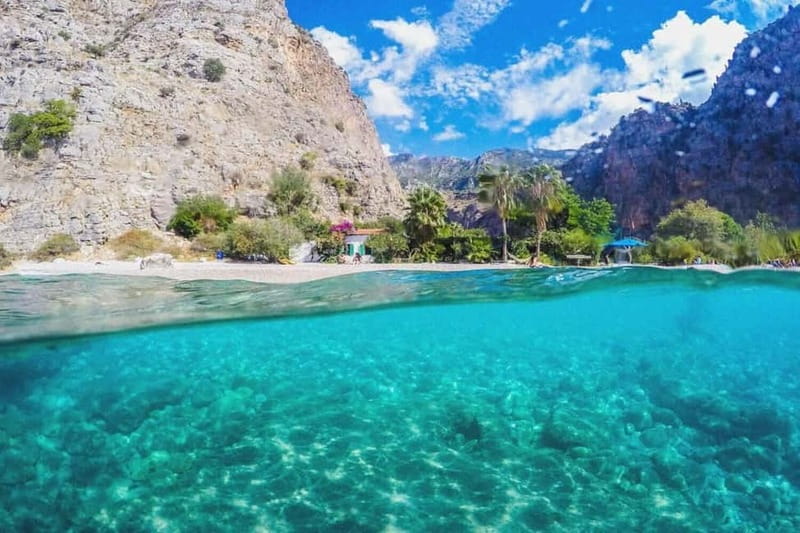 Ölüdeniz: Blue Cave, Butterfly Valley & Lunch Boat Tour - Aquarium Bay: lunch onboard, then fish-filled water time