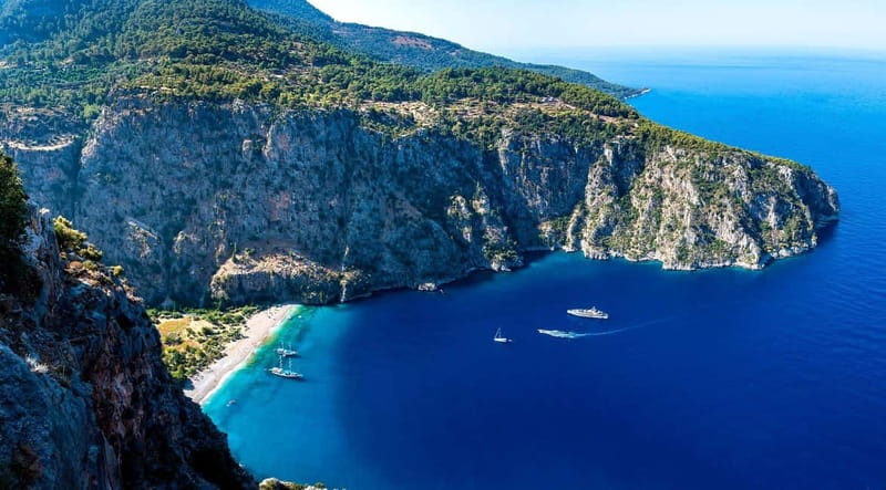 Ölüdeniz: Blue Cave, Butterfly Valley & Lunch Boat Tour - Butterfly Valley: dramatic cliffs, a sheltered beach, and a slower pause
