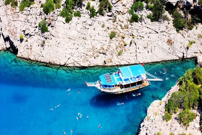 Porto Genoese Boat Trip With Mud Baths From Kemer - Suluada swim break: crystal-clear water with snorkeling gear and life jackets