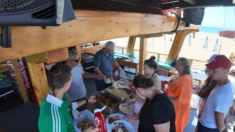 Side: Dolphin Boat Tour With Lunch Foam party Swimming - The final swim near Karaburun Bay: dolphin watching in the scenery
