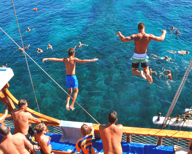 Side: Dolphin Island Boat Tour with BBQ Lunch - The onboard vibe: games, animations, and optional fun